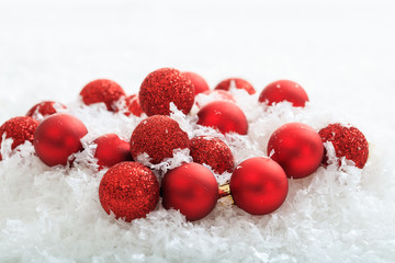 Christmas balls and snow on white background