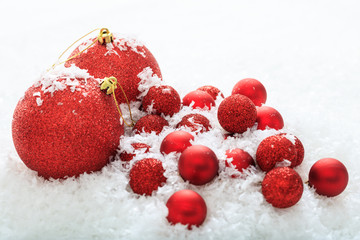 Christmas balls and snow on white background