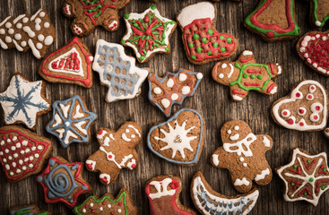 Colorfully Christmas cookies on rustic wooden background - obrazy, fototapety, plakaty