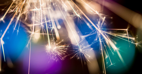 Holiday background with a sparklerr