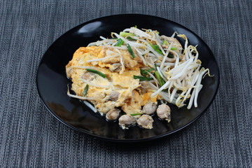Thai food,Fried egg and oyster with bean sprouts and shallot as