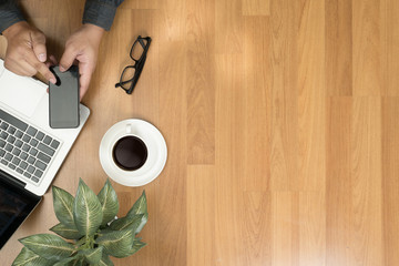 Hipster wooden desktop with laptop, office accessories, flat lay