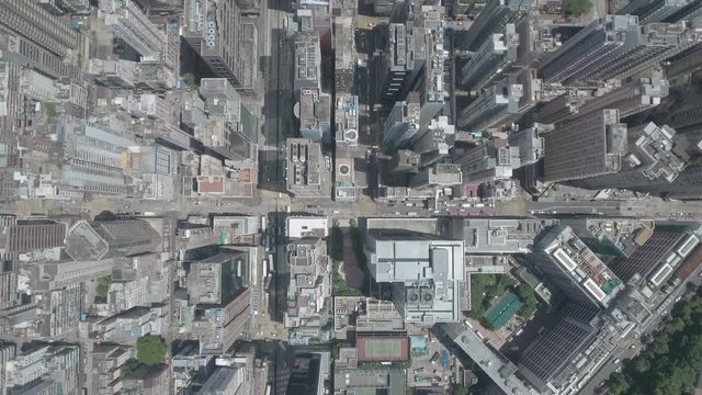 Abstract aerial drone footage of rooftops and streets, densely populated Hong Kong