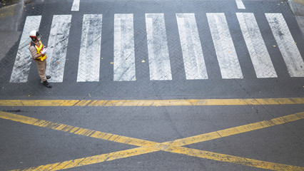 the top view of road and Crosswalk with security guard stand on the street.