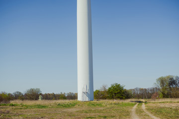 Bright blue sky moving and wind turbine