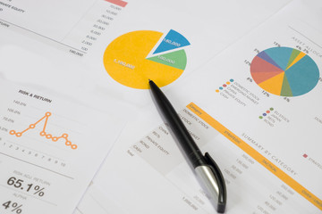 Investment planning and reporting concept. Closed up of invesment planning report containing colourful graph of asset allocation planning.