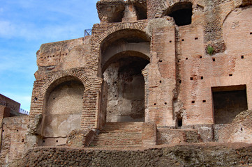 Roman Ruins red brick building blue cloudy sky
