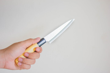 Hand holding a knife.