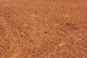 plowing a farm field in preparation for spring planting.