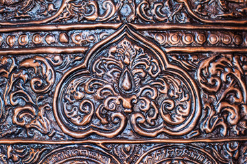 Ancient golden carving still window of Thai temple. Thailand