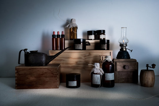 old pharmacy. bottles, jars, kerosene lamp on wooden shelves