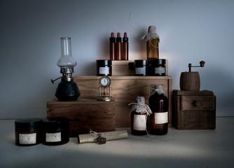 Obraz na płótnie Canvas monasterypharmacy. bottles, jars, a kerosene lamp on wooden shelves