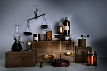 monastery pharmacy. bottles, jars, scales, a kerosene lamp on wooden shelves