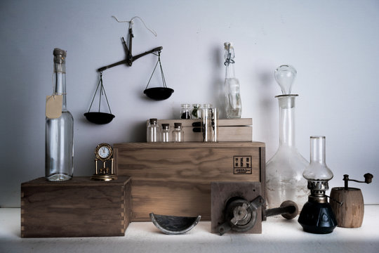 monastery pharmacy. bottles, jars, scales, a kerosene lamp on wooden shelves