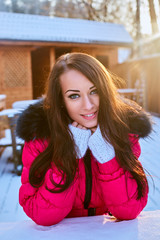 Portrait of smiling female in a snowy day.