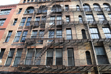 Fototapeta premium old building with iron fire escape stairs