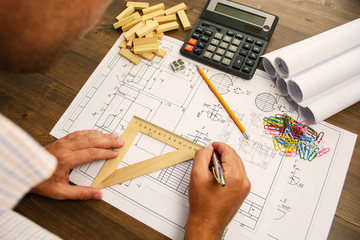 Financial paper charts and graphs on the table.