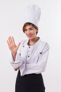 female asian chef pointing up five fingers gesture