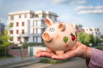 All savings money from piggy bank to pay for the dream home