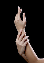 beautiful young hands woman isolated on black background