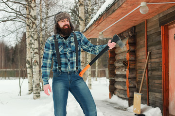 man in winter with axe