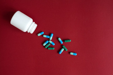 blue tablets in plastic container top view
