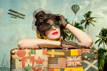 Woman traveler embraces a vintage suitcase. Photo in old image s