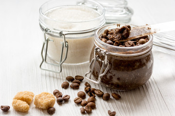 homemade coffe scrub in glass jar on wooden background