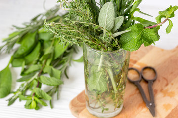 summer bouquet of spicy herbs in glass close up