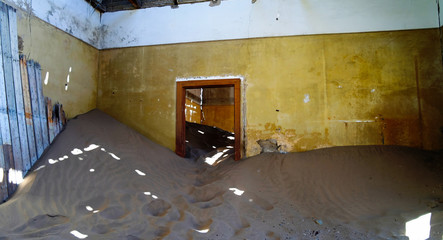 Interior of ruined house in ghost-town Kolmanskop, Namibia