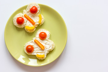 kid breakfast butterfly sandwiches top view on white background