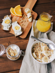 healthy breakfast bowl of yogurt with granola and eggs