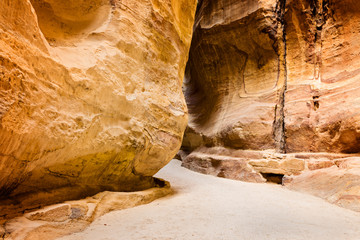 The Siq, the narrow slot-canyon that serves as the entrance passage to  Petra city, Jordan