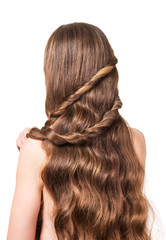 Woman with long wavy brown hair isolated on white background.