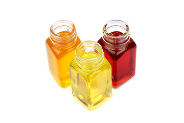 Three bottles with oils isolated on white