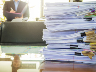 Business Concept, Pile of unfinished documents on office desk, Stack of business paper