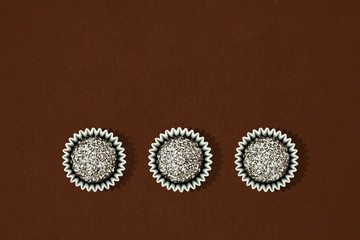 sweet truffles on brown background