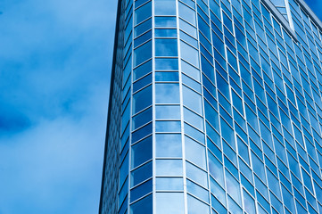Image of modern office building against cloudy sky