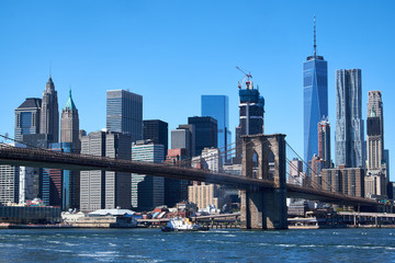 NEW YORK CITY - SEPTEMBER 25, 2016: Manhattan skyline and Brooklyn Bridge at daytime, seen from Dumbo in Brooklyn