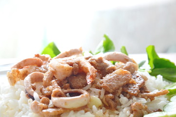 fried garlic seafood and pork with pepper on rice