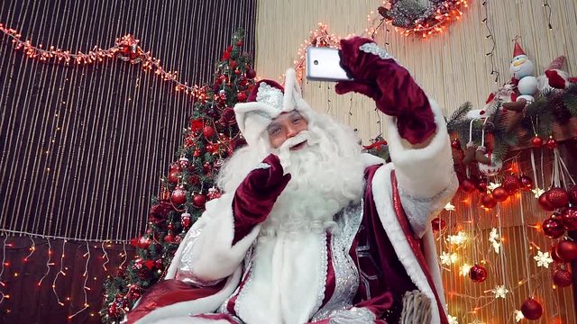 Santa Claus online communication with children in phone live stream