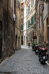 A charmingn narrow street in the historic center of Rome, Italy