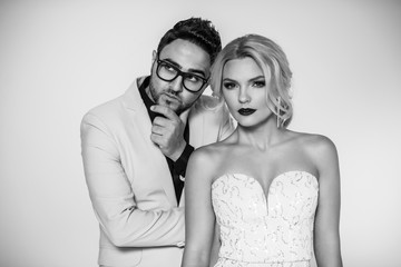 young fashion couple on a white background in studio