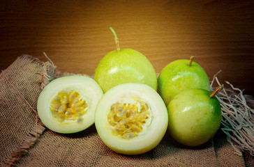 Fresh Green Passion fruits on wooden background
