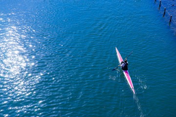 Water sports image, people rowing in canoe on river