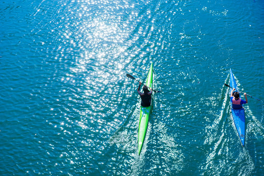 Water sports image, people rowing in canoe on river