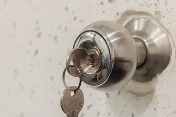 Insert key into lock (closeup)