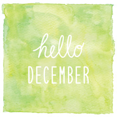Hello December text on green watercolor background