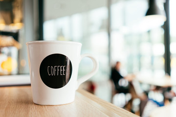 Background image with coffee mug, cup at cafe table