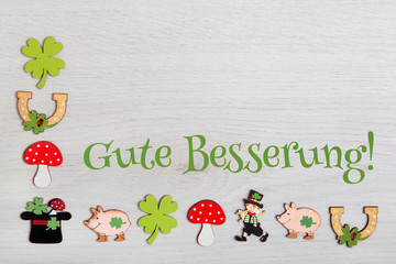 Hintergrund mit Glückssymbolen-Gute Besserung